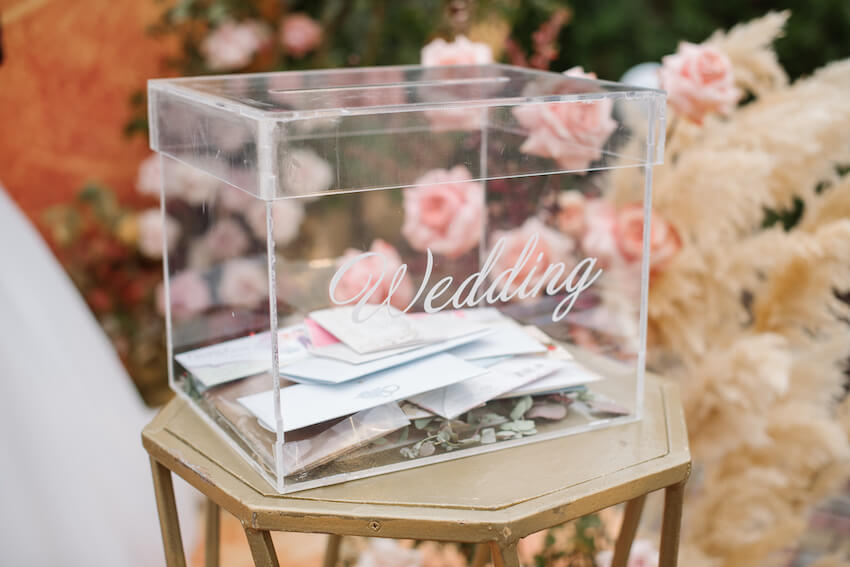 Blush garden roses in a weathered stone urn